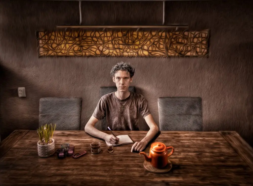 Lucas Casca at the table with notebook, tea, and winter bulbs